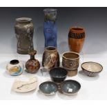 A collection of studio pottery, including a Michael Leach for Yelland Pottery bowl with striped