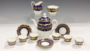 A Coalport Hazelton pattern coffee service, decorated with gilt fruiting vine against a cobalt