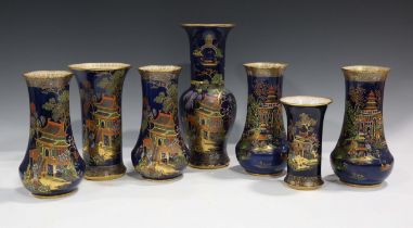 Seven blue ground Carlton Ware vases, comprising a New Mikado pair, height 20cm, three others in the