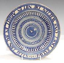 An inscribed Continental tin glazed earthenware dish, probably low countries, dated 1567, painted in