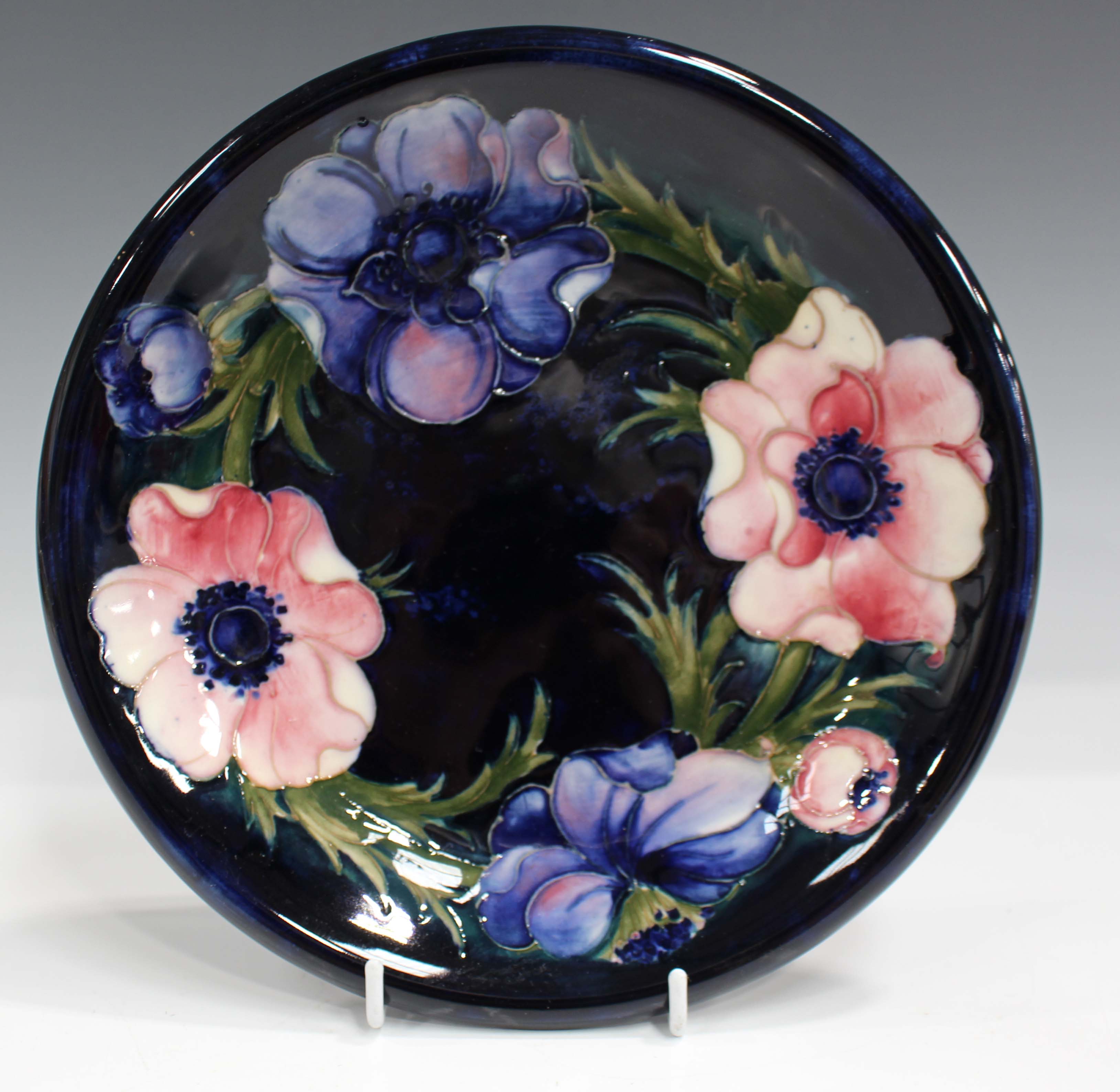 A Moorcroft dark blue ground Anemone pattern plate, mid-20th century, impressed facsimile - Image 3 of 6