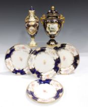 A Coalport cobalt blue ground two-handled vase and cover, early 20th century, the ovoid body painted