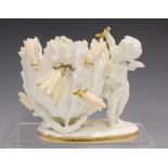 A Moore Brothers porcelain jardinière, late 19th century, modelled as a cherub standing beside a