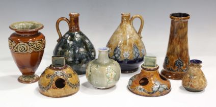 Eight pieces of Doulton stoneware, including a Royal Doulton miniature vase, decorated by Ethel