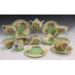 A group of Clarice Cliff Spring Crocus pattern wares, comprising a cylindrical preserve pot and