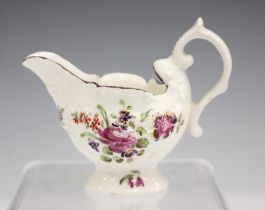 A Derby dolphin ewer cream jug, circa 1770, the shell moulded body painted with polychrome flowers