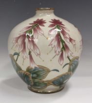 A Cobridge pottery vase, the ovoid body decorated with stylized hostas, impressed and painted