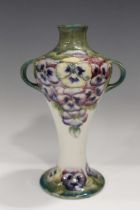 A Macintyre Moorcroft Pansy pattern two-handled vase, circa 1911-13, brown printed mark, green