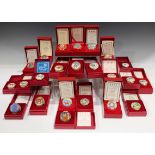 Twenty-seven Halcyon Days Christmas enamel boxes, 1979-2002, all boxed, majority with certificates.