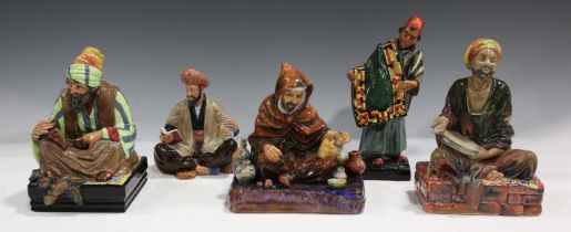 Five Royal Doulton figures, comprising The Potter, HN1493, Carpet Seller, HN1464, Mendicant,