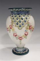 A Macintyre Moorcroft vase, circa 1907-1909, the baluster body decorated with swags of roses and