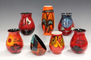 Seven pieces of Poole pottery, including two Delphis range vases, both decorated by Cynthia Bennett,