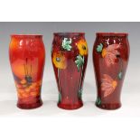 Three Anita Harris studio pottery vases, including one decorated with a daisy chain, printed and