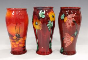 Three Anita Harris studio pottery vases, including one decorated with a daisy chain, printed and