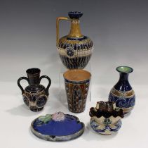 Six pieces of Doulton stoneware, including a Doulton Lambeth tapered beaker, decorated by Harriet E.