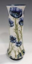 A Macintyre Moorcroft Florian ware vase, circa 1903-1904, the slender body decorated with the