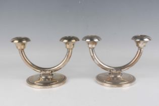 A pair of Norwegian .830 silver twin-branch candelabra, each semicircular branch with circular