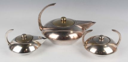 An Art Deco Style French plated three-piece tea set of squat circular form with raised curved