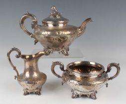 An early Victorian silver three-piece tea set each piece of squat circular form with engraved