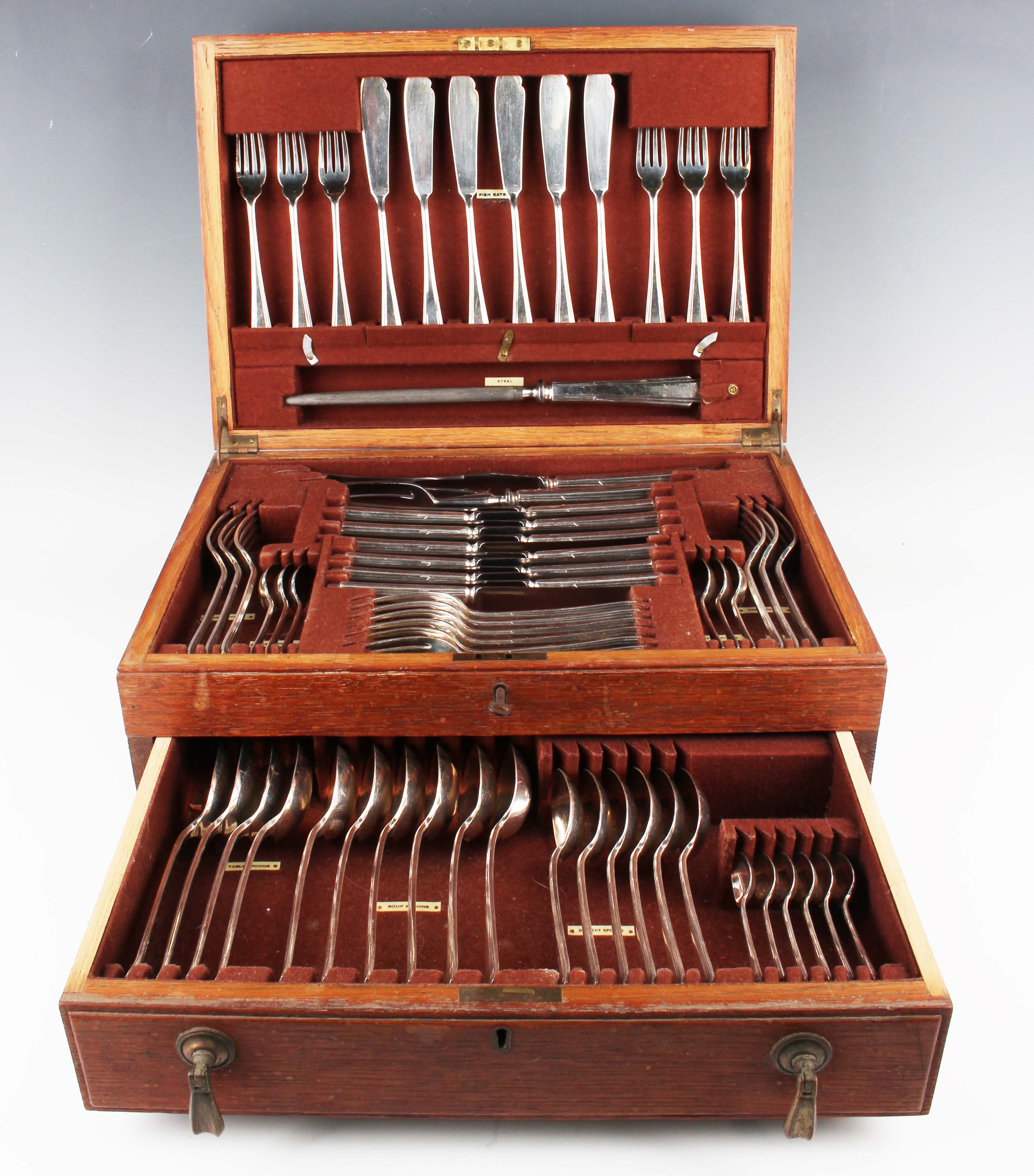 An Art Deco canteen of plated cutlery, comprising four tablespoons, six table knives and forks,