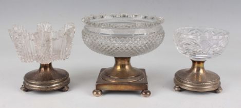 A pair of Dutch silver salt stands of circular form with ropetwist borders, raised on knop feet,