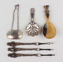 A late Victorian Scottish silver caddy spoon with bright cut and shell handle and scalloped bowl,