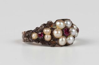 A mid-Victorian gold and silver set, half-pearl and red gem set cluster ring, mounted with three