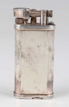 A Dunhill 'Unique' plated gas lighter with vertical banded decoration, detailed 'Made in England',