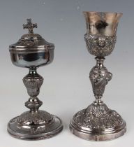 A late 19th/early 20th century Continental .800 silver chalice, decorated in relief with amorini and