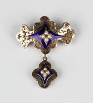 A 19th century blue enamelled and half-pearl brooch of quatrefoil form with engraved decoration,