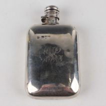 A late Victorian silver hip flask of curved rectangular form with screw hinged lid, London 1892 by