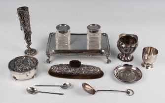 An Edwardian silver rectangular inkstand with gadrooned and foliate cornered rim, fitted with two