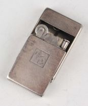 A George V silver rectangular slide-action lighter, London 1935 by Asprey & Co Ltd, weight 52.4g,