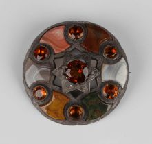 A Victorian silver, varicoloured agate, citrine and orange gem set circular brooch in a Celtic