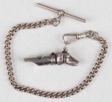 An Elizabeth II silver whistle with dog's head terminal, London 1977 by PW, length 3.8cm, with a