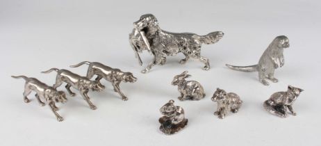 A plated model of a Springer Spaniel carrying a fallen rabbit in its mouth, height 7.3cm, together