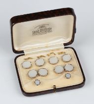 A gold, platinum mounted and mother-of-pearl dress set, comprising a pair of cufflinks, dimensions