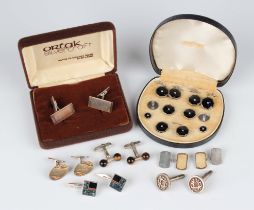 Four pairs of silver cufflinks, including a pair designed as dumbbells with tiger's eye terminals,