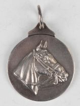 An Edwardian 'National Horse Association of Great Britain' silver medallion, the obverse cast with a