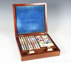 A late Victorian mahogany cased artist's box by J. Hancock & Son, the hinged lid enclosing a