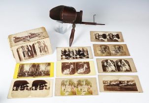 A group of stereoscopic viewing cards, glass slides and a hand-held viewer.Buyer’s Premium 29.4% (