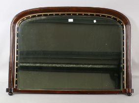 A late Victorian Aesthetic Movement simulated rosewood overmantel mirror, the ebonized inner