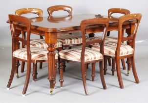 A mid-Victorian mahogany extending dining table, the top with single extra leaf, height 78cm,