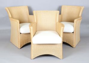 A set of three modern Lloyd Loom tub back armchairs, height 84cm, width 70cm, depth 80cm.Buyer’s