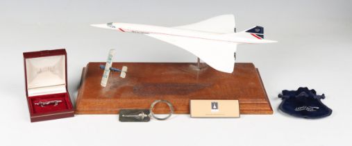 A small group of Concorde related collectors' items, comprising a limited edition print after Ronald