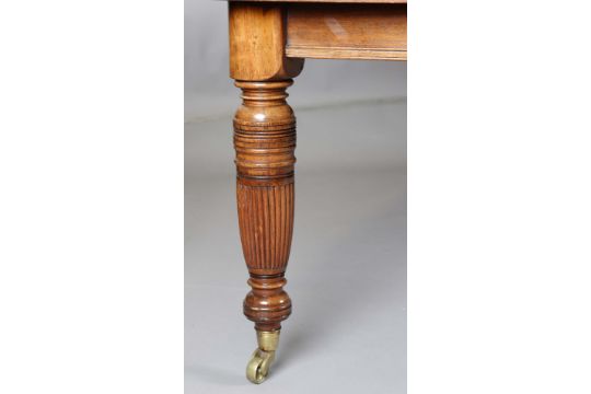 An Edwardian stained walnut extending dining table, the top with two extra leaves, raised on - Image 2 of 7