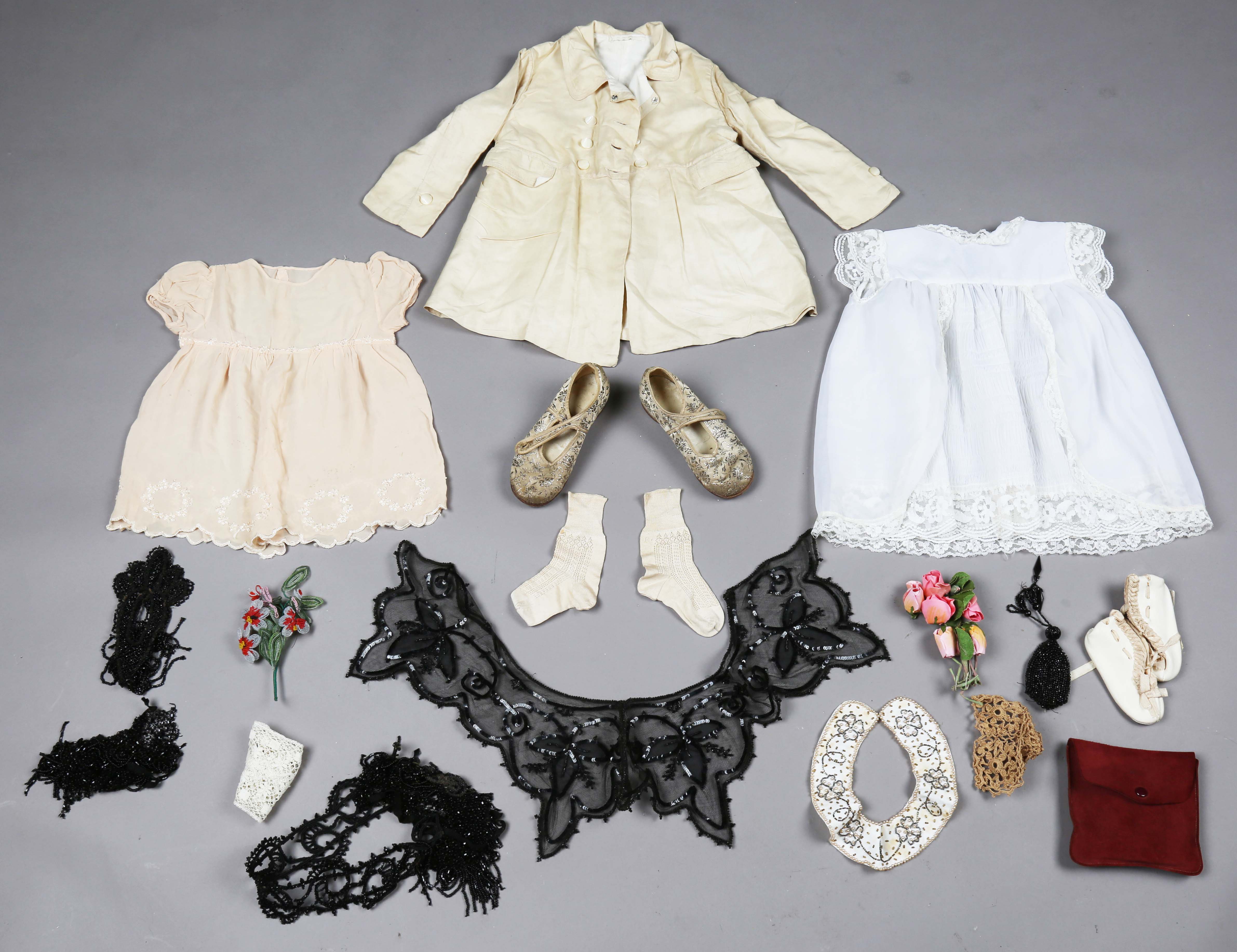 A selection of mainly early 20th century costume, including a pair of infant's shoes with silver