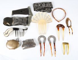 A George V silver purse, Chester 1911, a similar brass purse, a group of hair combs and a plated