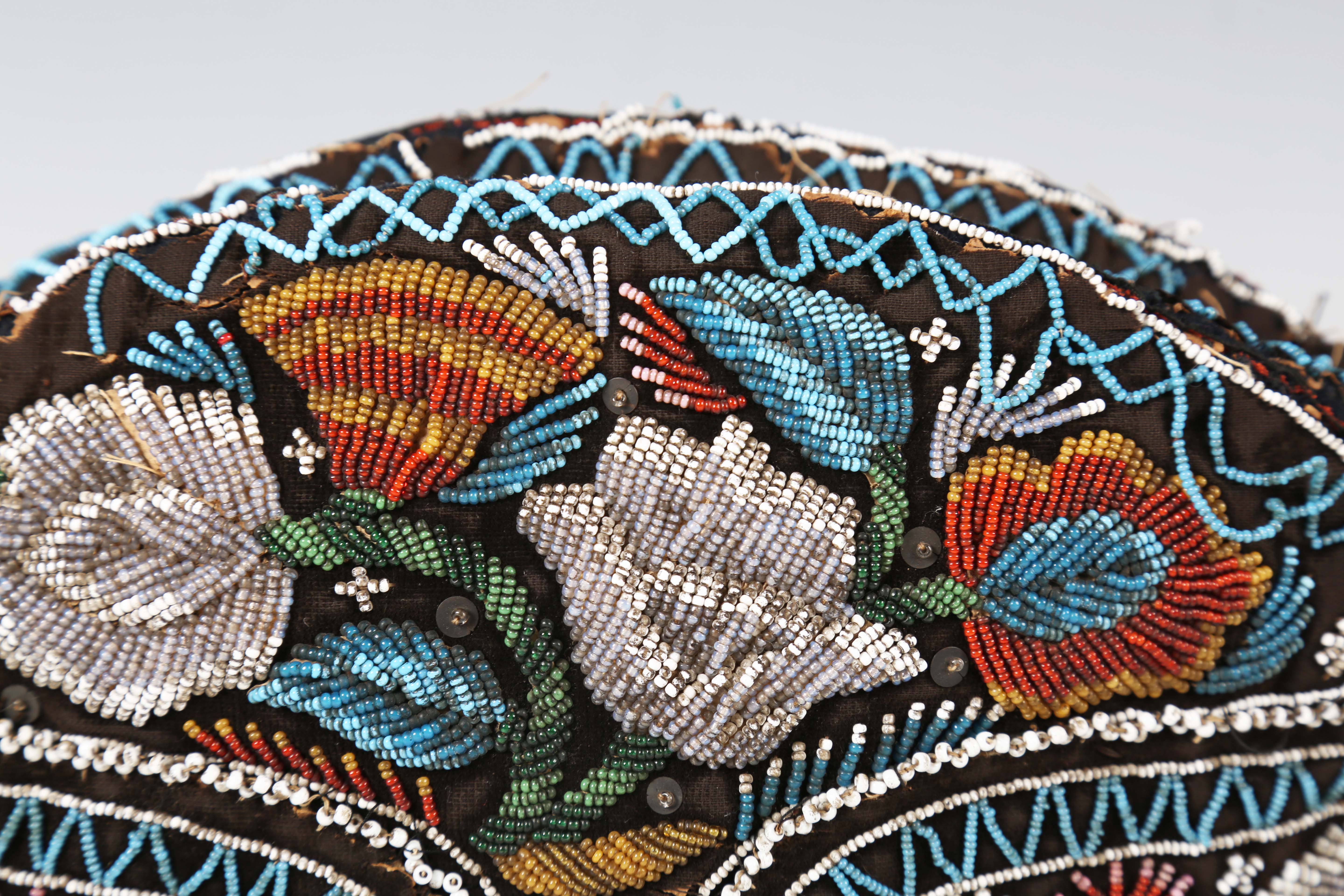 A 19th century beadwork and silk gentleman's cap, heavily beaded with flowers within zig-zag - Image 11 of 13