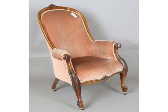 A Victorian walnut showframe salon armchair, carved with leaf and flower decoration, upholstered - Image 1 of 11